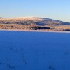 Vacker bild från granhult den 19 januari 2014 det var -36,5 grader kallt och klart med sol över sjön Vallsjärv med Svartberget i bagrunden